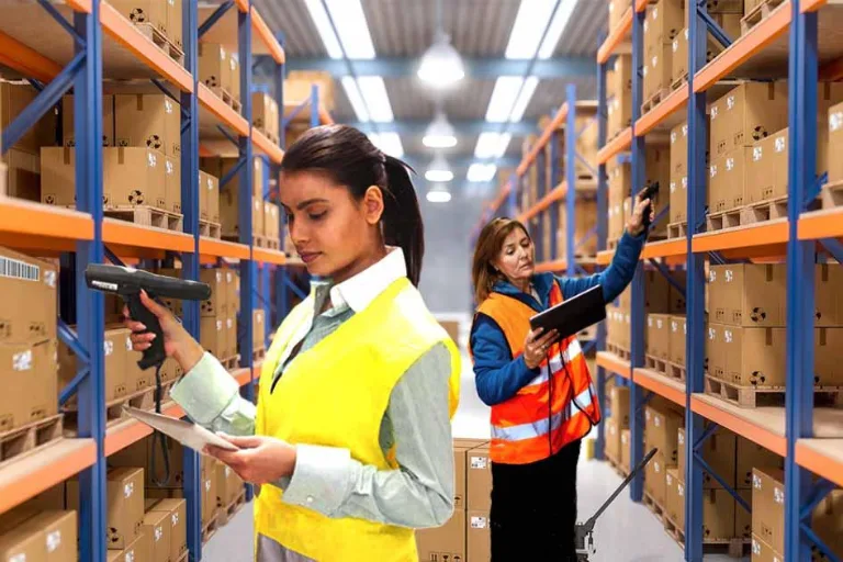 Warehouse team performing physical stock verification and comparing it with book stock records during an inventory reconciliation process.